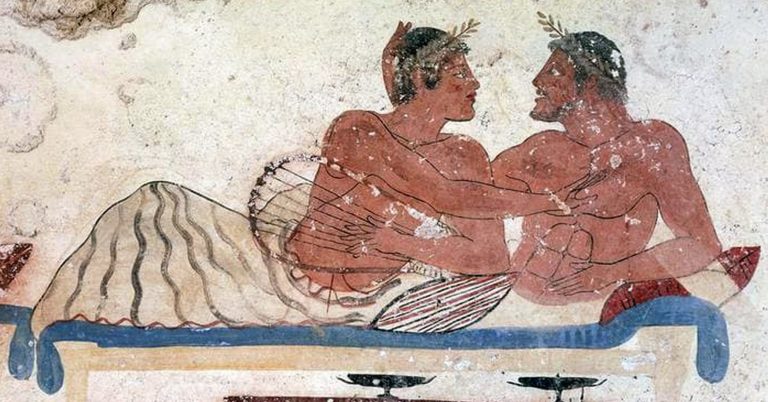 Ancient Greek fresco depicting two men lying on a bed looking at each other. One is playing a lyre-like instrument while the other strokes h